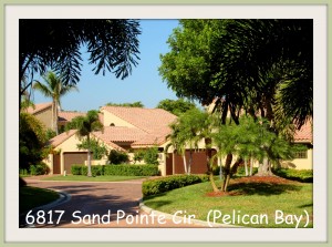 Sand Pointe Villa in Pelican Bay - Lovely end unit with views of lake and tropical garden.